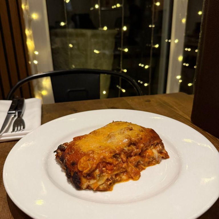 Gratitude table Selection of Southern Italian dishes at Amore & Limoncello, featuring Neapolitan pizza, fresh handmade pasta